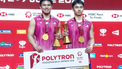 Goh Sze Fei and Nur Izzuddin Rumsani pose with their trophy after winning the 2026 Indonesia Open badminton men’s doubles title in Jakarta. (Photo: BWF)